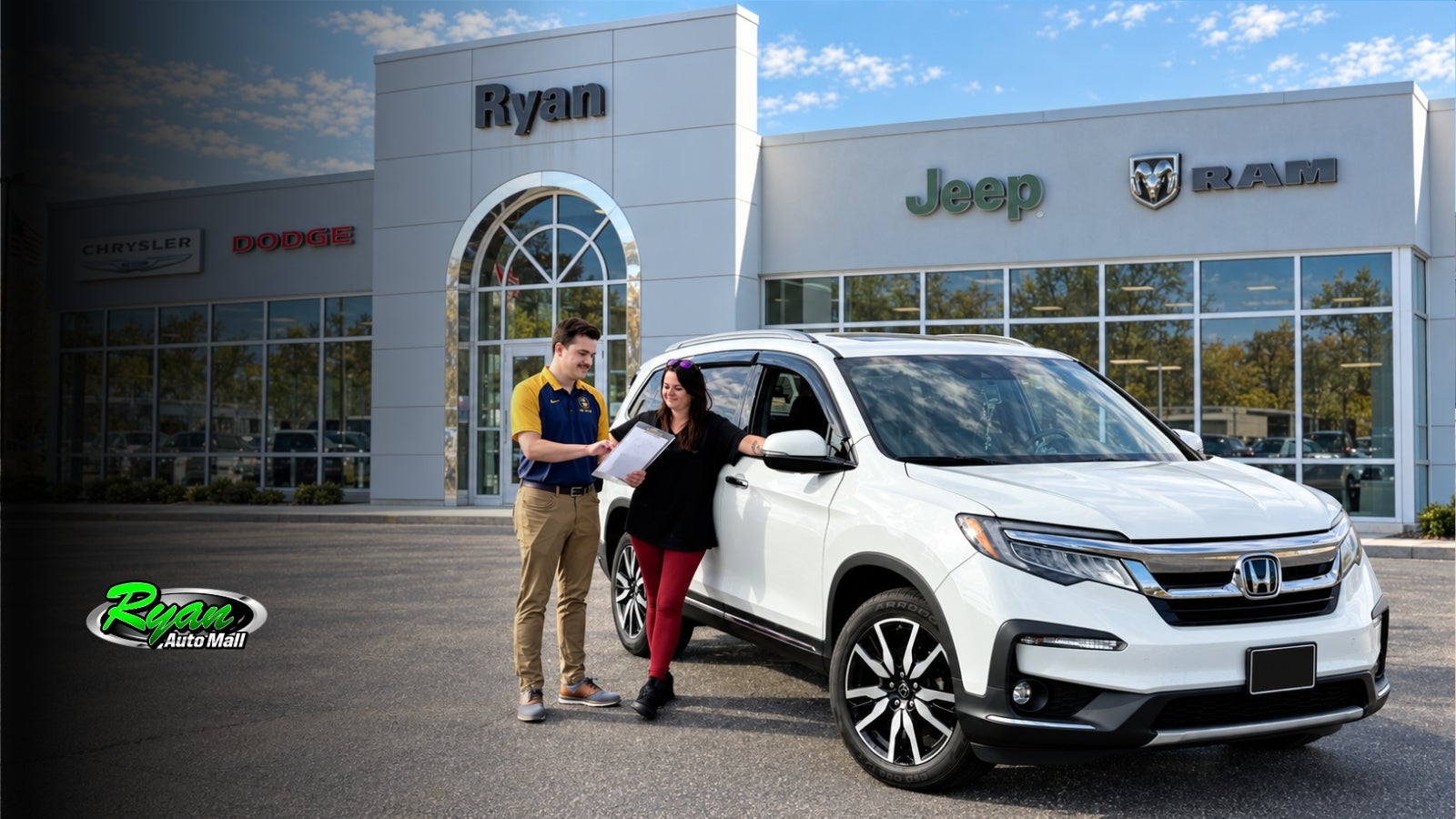 Two people reviewing a clipboard beside a white Honda Pilot in front of Ryan CDJR Buffalo