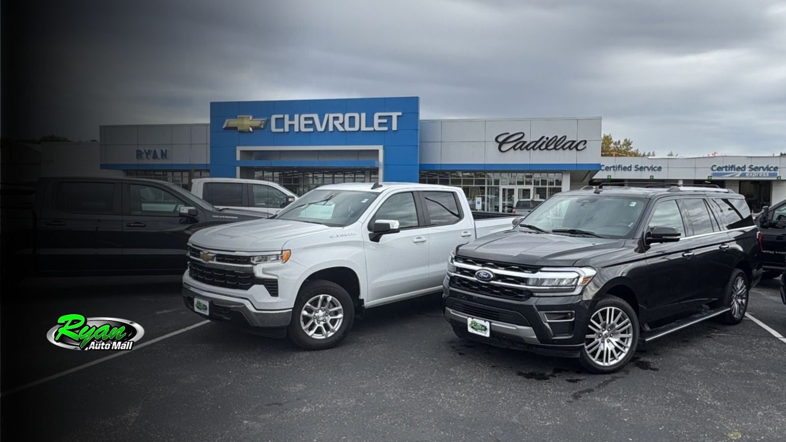 Used SUV and pickup truck parked side by side at Ryan Auto Mall
